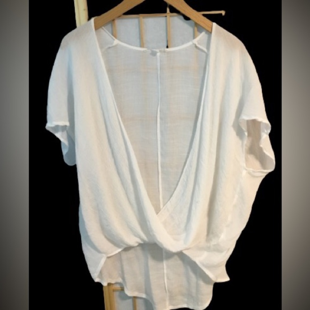 White Gauze Top. Crisscrossfront. Longer in back.